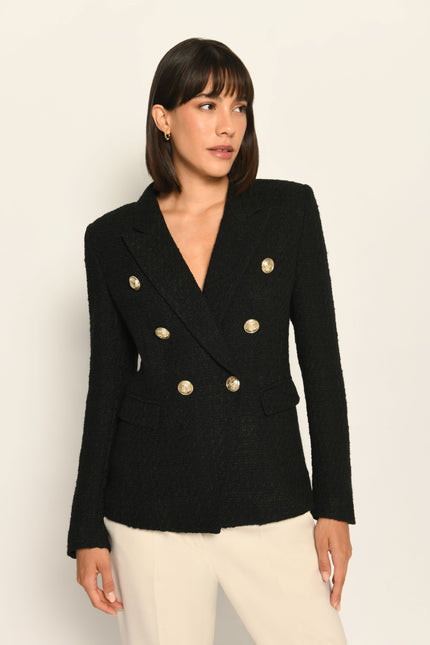 Zweireihiger schwarzer taillierter Bouclé-Blazer für Damen, kombiniert mit beiger Stoffhose – Nahaufnahme